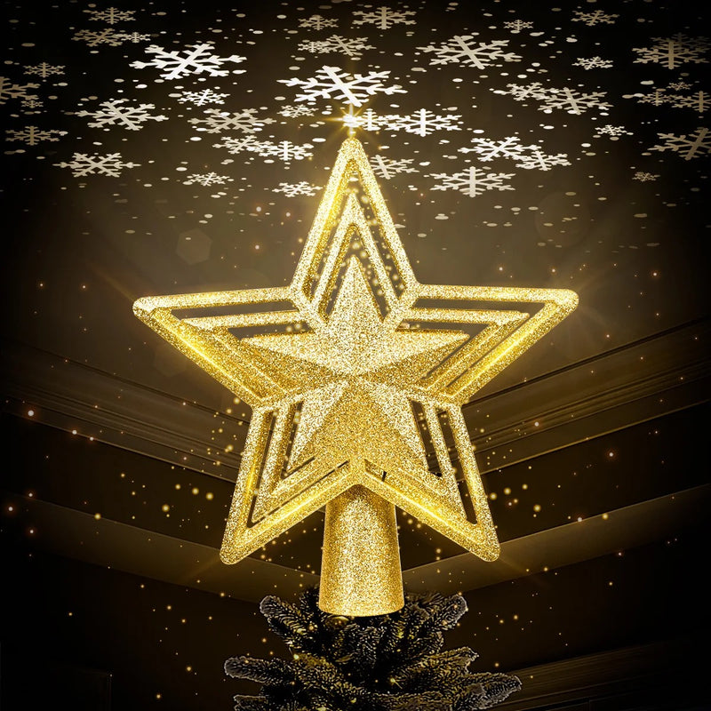 Stella gold glitter star tree topper glowing against a dark background with snowflakes