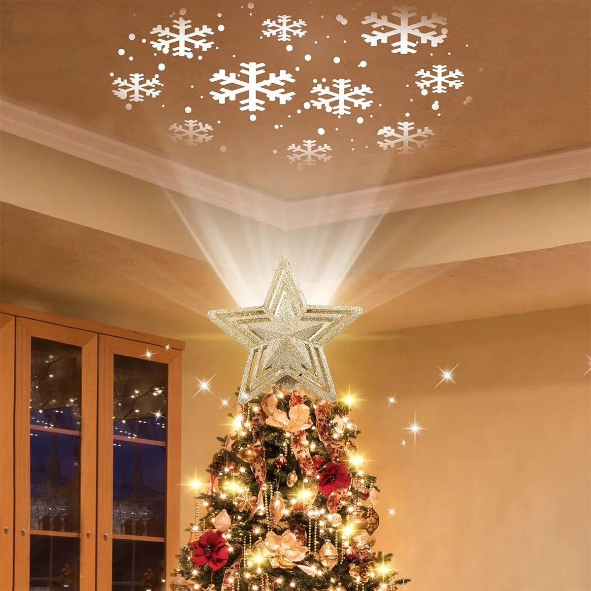 Snowflakes projected across a living-room ceiling by the Stella star topper