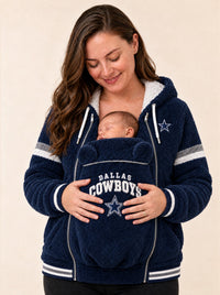 Mom wearing the Dallas Cowboys Game Day Carrier Hoodie with her newborn asleep in the bear-ear pouch