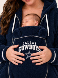 Close-up of a newborn sleeping in the pouch of the Dallas Cowboys carrier hoodie