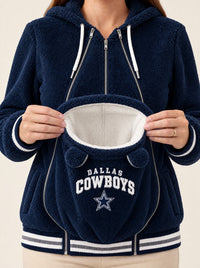 Hands opening the empty baby pouch to show the soft white sherpa lining