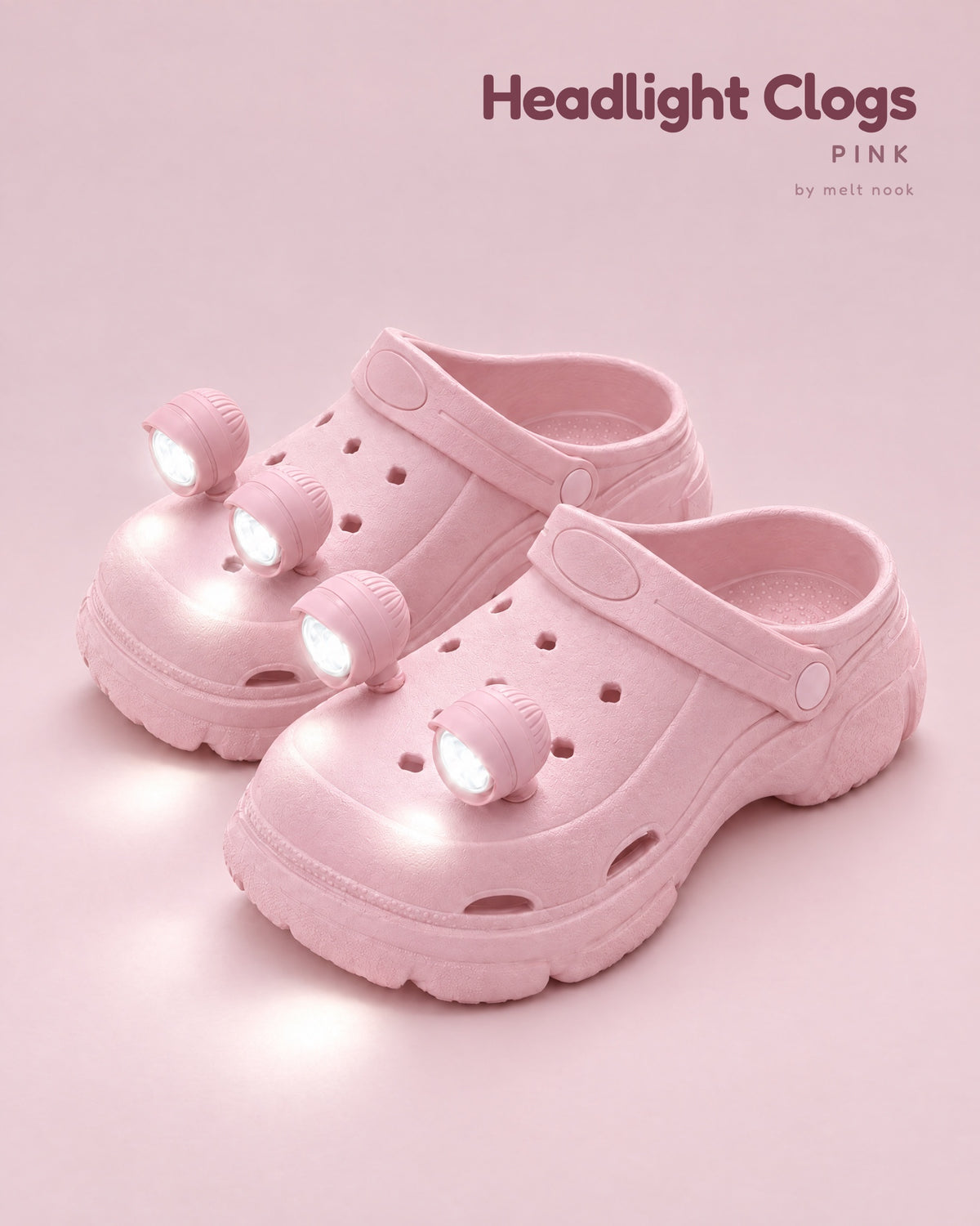 Pink platform clogs with four pink LED headlights glowing on the toes