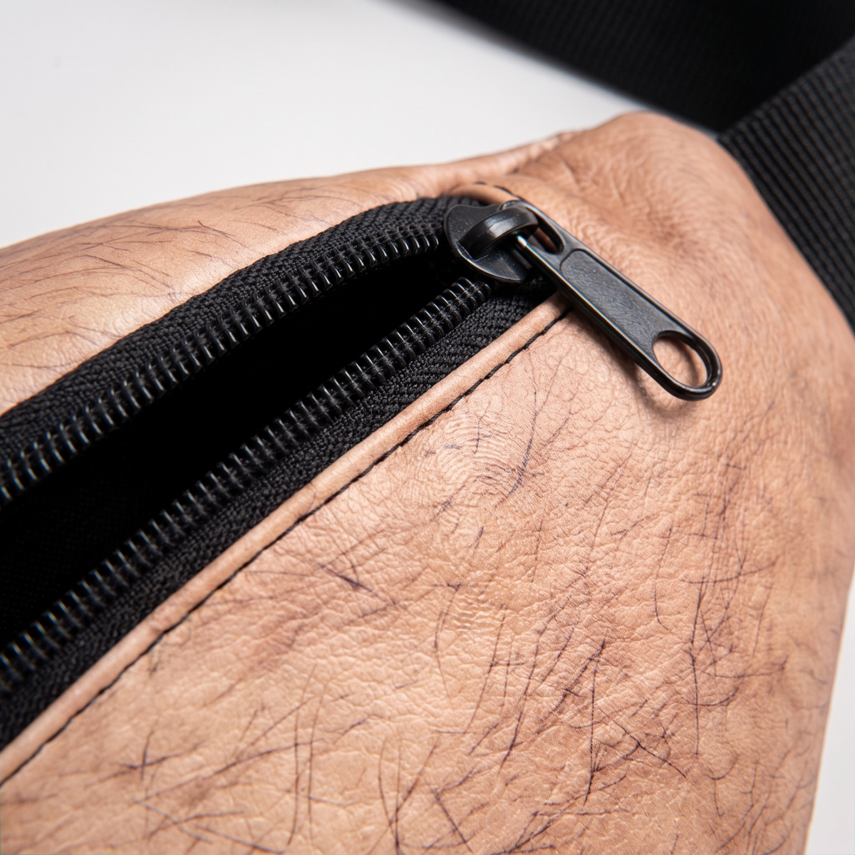 Macro of the Hank zip, binding tape and printed skin texture