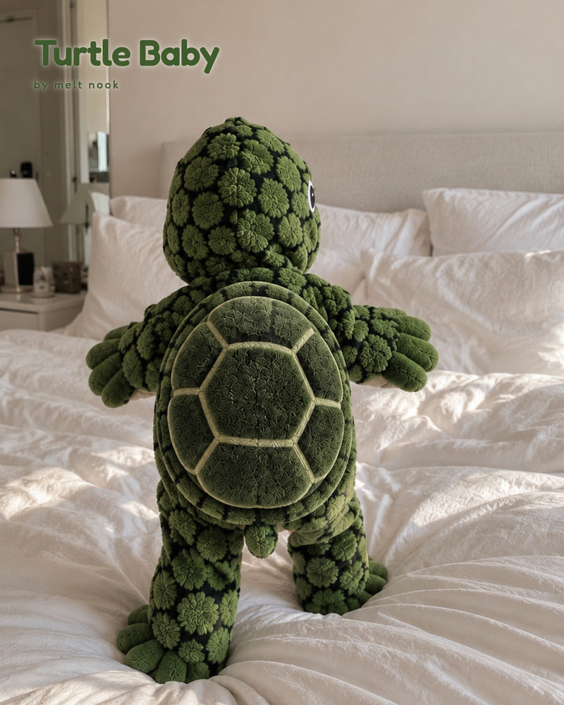 Back of the Turtle Baby onesie showing the soft padded turtle shell