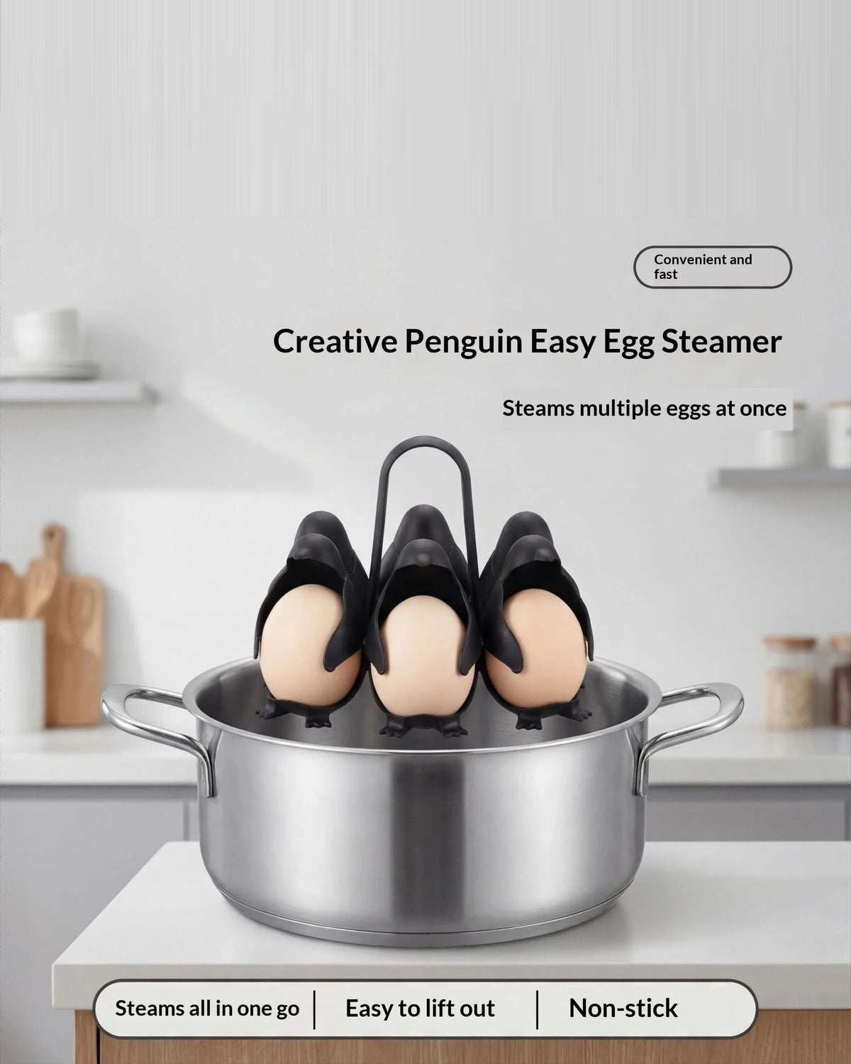 The penguin egg holder resting on the rim of a steel pot in a bright kitchen. Text on the image reads: Creative Penguin Easy Egg Steamer, steams multiple eggs at once, steams all in one go, easy to lift out, non-stick.